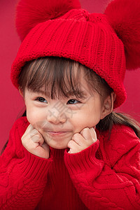 毛衣摄影穿红衣戴红帽的可爱小女孩图片