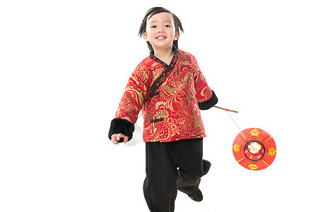 气氛可爱的愉悦一个小男孩手提红色灯笼庆祝新年图片