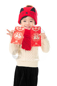 吉祥文字红色传统节日影棚拍摄可爱的小男孩过年拿红包背景