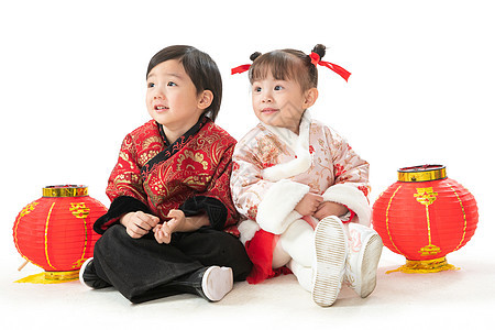 天真背景分离吉祥庆祝新年的两个小朋友坐在地上玩耍图片
