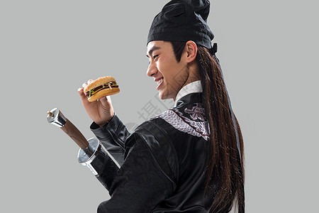 亚洲人侠客人吃汉堡的青年男人图片