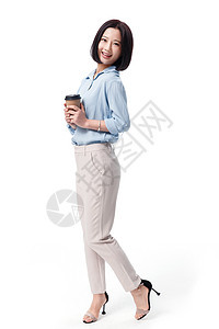 女商务站着女白领手拿咖啡杯图片
