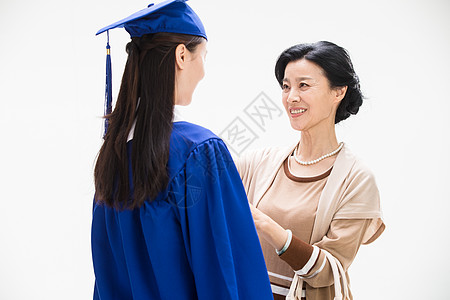 斗篷下母女留学生庆祝幸福快乐的母女背景