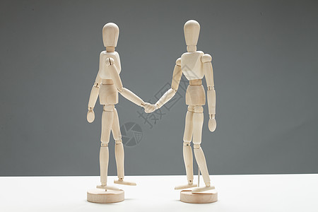 人工智能握手合作模型可爱的木偶背景