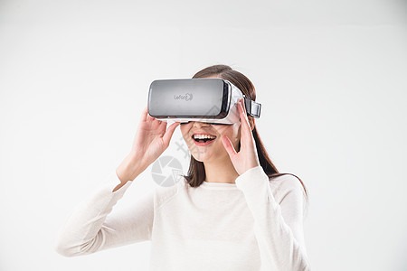 科技专业创新快乐戴着VR眼镜的青年女人背景