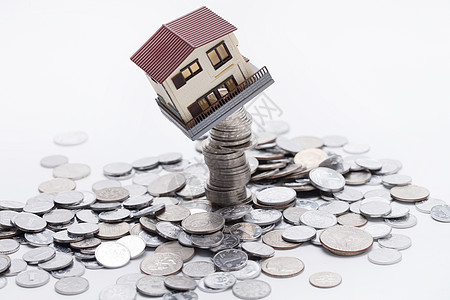货币抽象房地产硬币和房屋模型金融高清图片素材