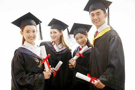 成功女性人生大事大学生穿着学士服庆祝毕业背景