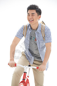 休闲高兴的成年人年轻的大学生骑自行车图片