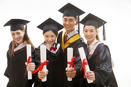 西方女性穿着学士服的大学生庆祝毕业背景