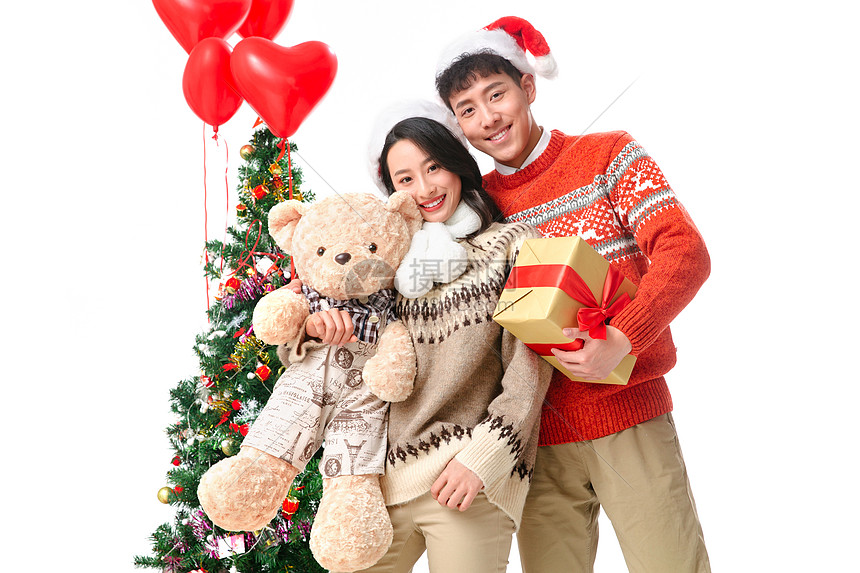 玩具熊水平构图快乐的青年情侣过圣诞节图片