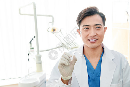 东方人外科手套卫生保健和医疗牙科医生在诊疗室图片