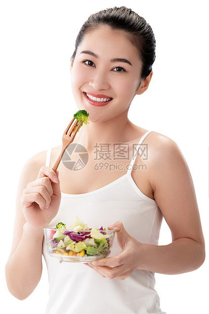 满意亚洲放松青年女人吃沙拉图片