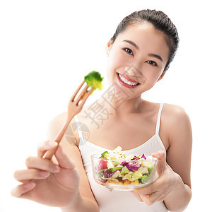 健康生活方式青年女人吃沙拉图片