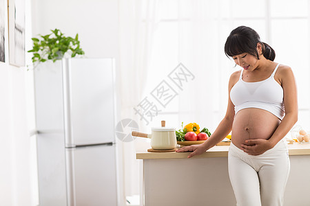 孕妇饮食摄影腹部青年女人幸福的孕妇背景