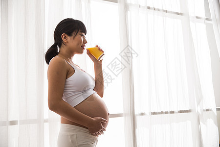 生长维生素摄影孕妇喝果汁图片