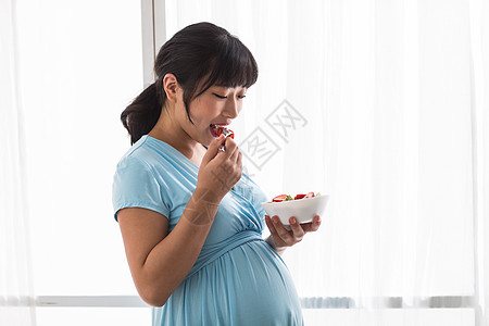家庭生活不看镜头蔬菜幸福的孕妇图片
