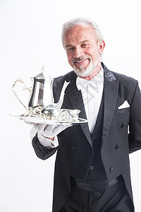 精力餐饮服务职业老年男人一个男侍者托着银餐具图片