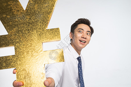 亚洲个成功商务青年男人拿着人民币符号图片