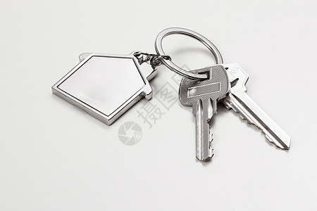 礼物标志钥匙与房子吊饰背景