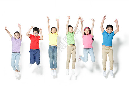 人群跳跃生长高举手臂欢乐的小学生跳跃背景