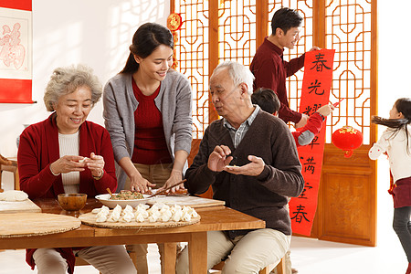 冬至祝福房屋温馨家园户内幸福家庭过年包饺子背景