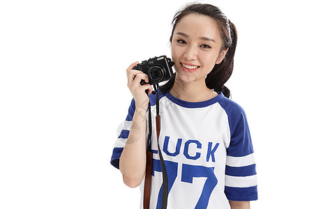 青年人东方人年轻女人拿着照相机图片