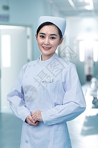 医生工作服工作服户内年轻的女护士在医院走廊图片