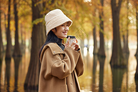 美女喝奶茶美女大学生手捧奶茶形象背景