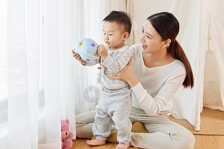 年轻女性年轻宝妈居家陪伴孩子玩耍背景