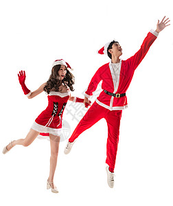 伴侣红色跳穿着圣诞服的快乐年轻情侣图片