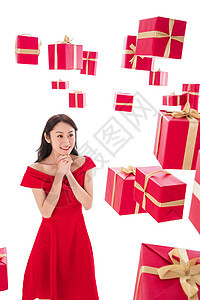 露齿一笑新年愉悦漂亮的青年女人与礼物图片
