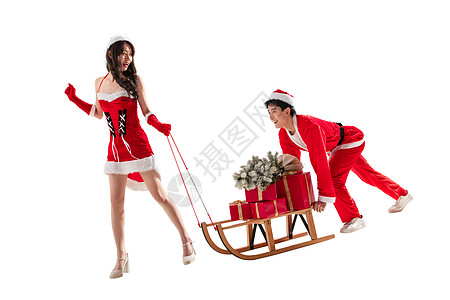 雪橇东方人帽子推运送圣诞礼物的年轻情侣背景