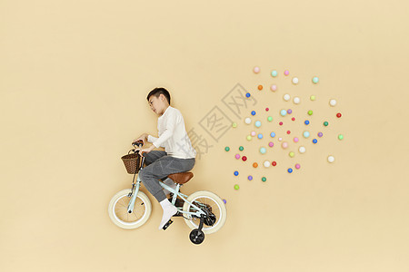 骑自行车学生骑着自行车飞在空中的儿童形象背景