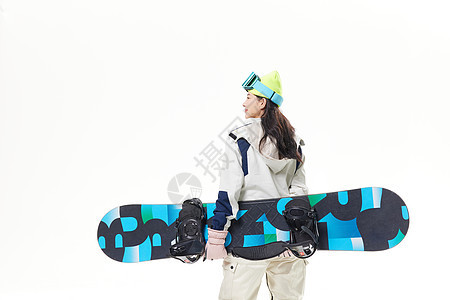 年轻美女拿着滑雪板背影图片