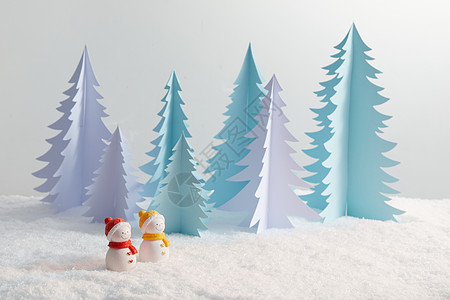 圣诞积雪积雪上的一对小雪人背景