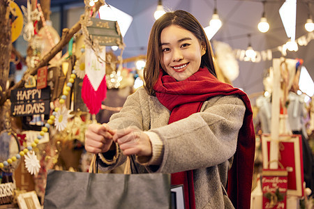 圣诞女性手拿购物袋图片