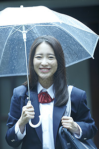 撑伞的漂亮女孩背景图片