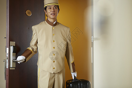 服务业谦恭的白天在酒店工作的人图片