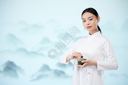 国风美女手端着茶杯背景图片