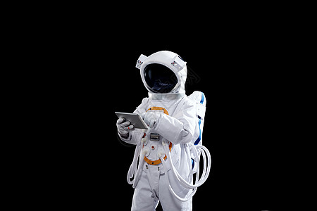 登月宇航员手拿平板电脑图片
