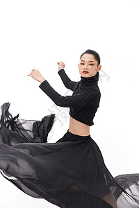 黑色纱裙女性舞者旋转背景图片