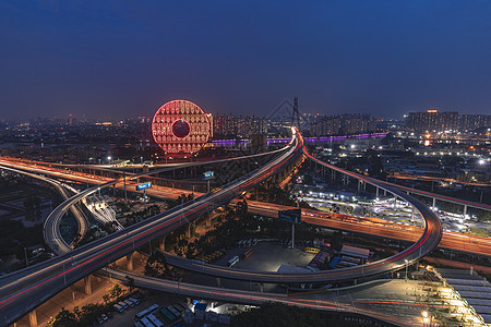 广州圆城市车轨道路夜景背景图片