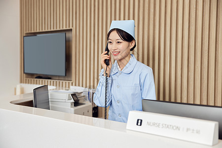 护士打电话医院前台护士站打电话的女护士背景