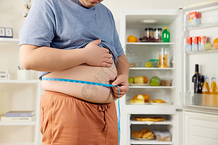 体重肥胖男性居家量腰围特写背景