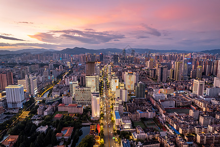 昆明万达双塔昆明城市CBD昆明市中心夕阳背景