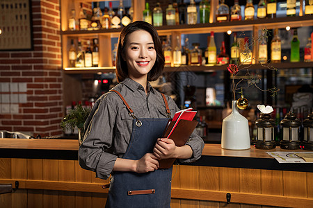 拿着菜单的餐吧女服务员图片