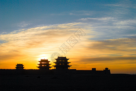 古风剪影夕阳下的嘉峪关城楼背景