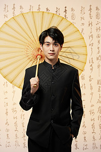 中国风水墨手举油纸伞的水墨国风少年背景