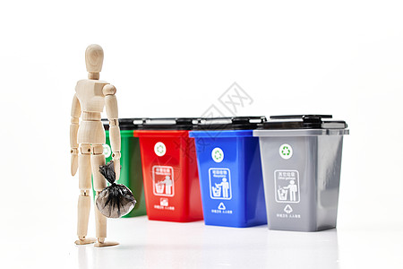 垃圾分类垃圾袋木头人偶绿色环保垃圾分类背景