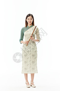 国风旗袍美女手拿竹笛形象图片